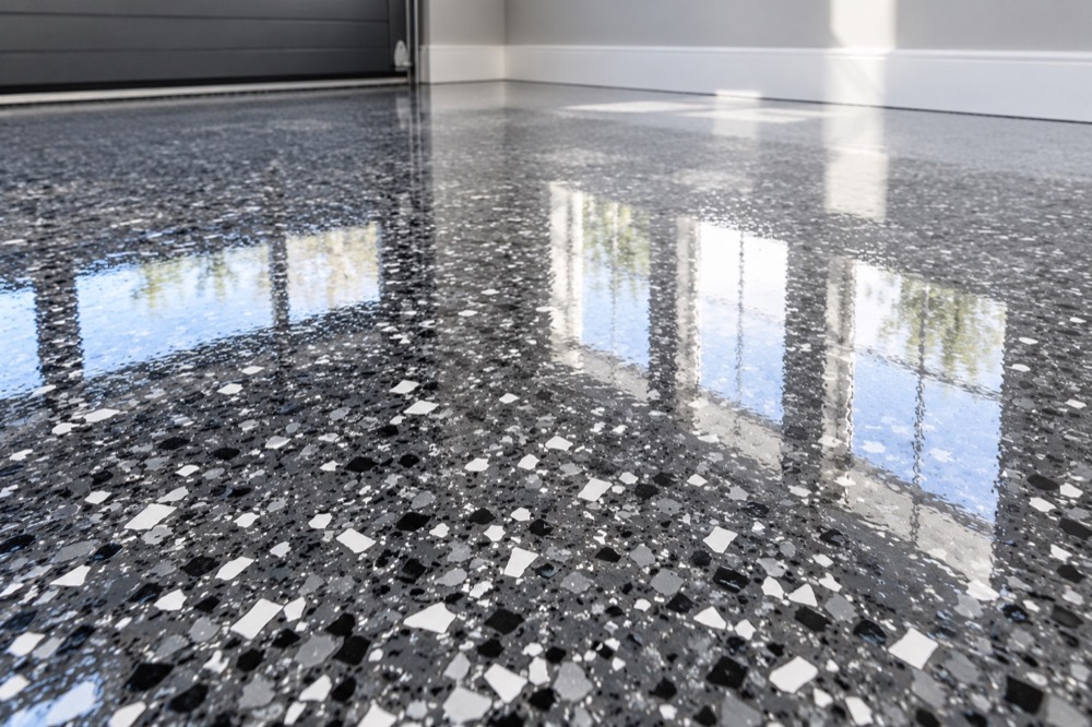 Graphite and silver flake epoxy beneath a glossy clear resin finish